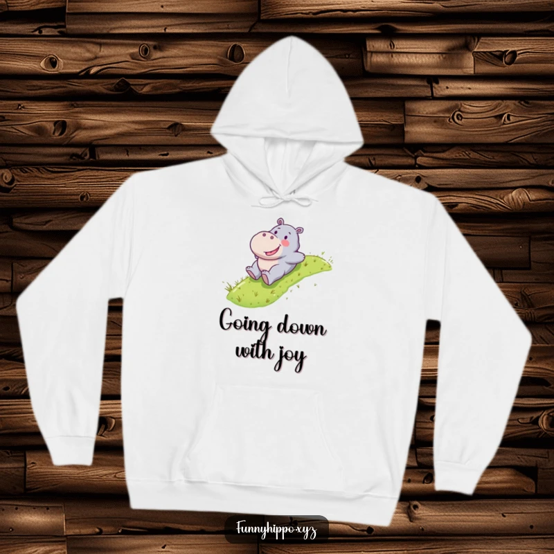 Funny Kawaii hippo happily sliding down a green grassy slope, a cozy and adventurous hoodie design.