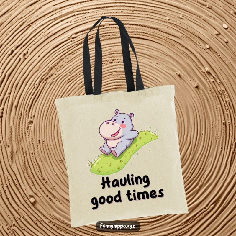 Funny Kawaii hippo character happily sliding down a grassy slope, a practical and fun tote bag.